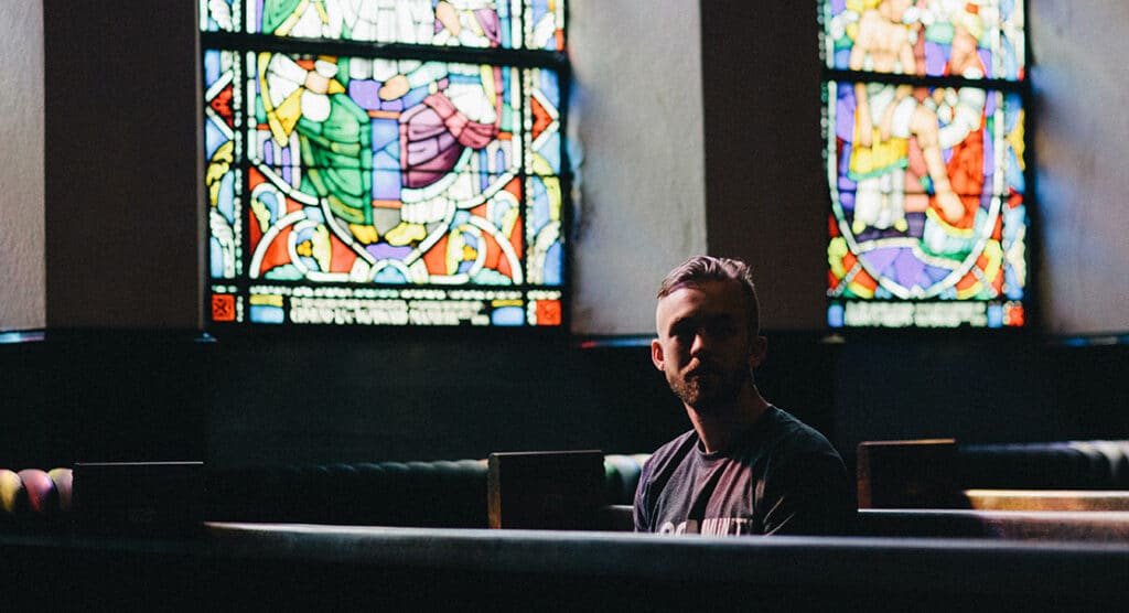Man sitting along in a church