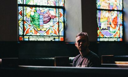 Man sitting alone in a church