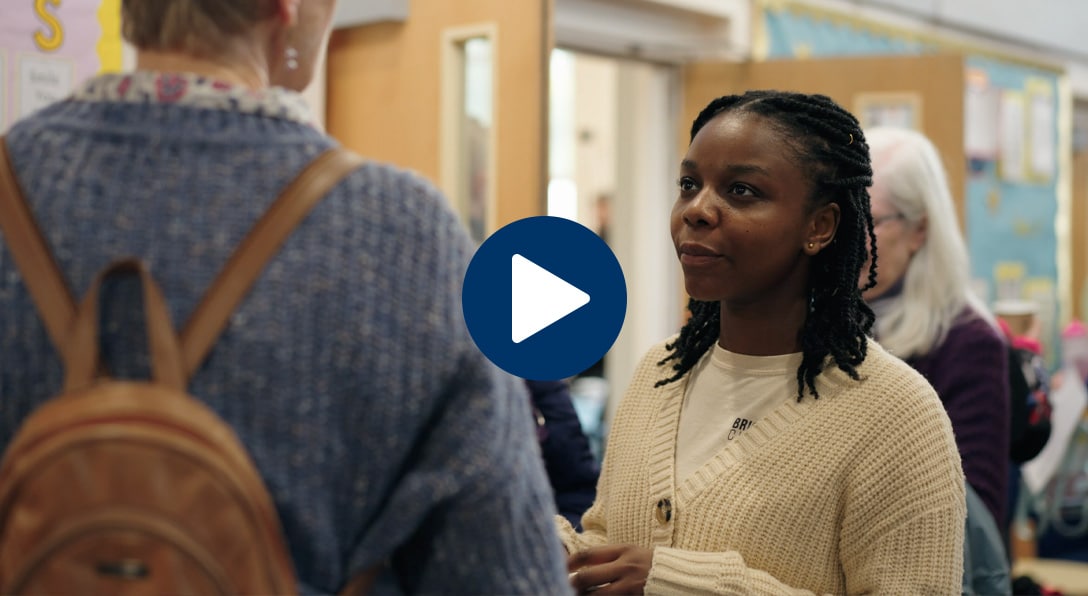 Video thumbnail showing two women talking at a church